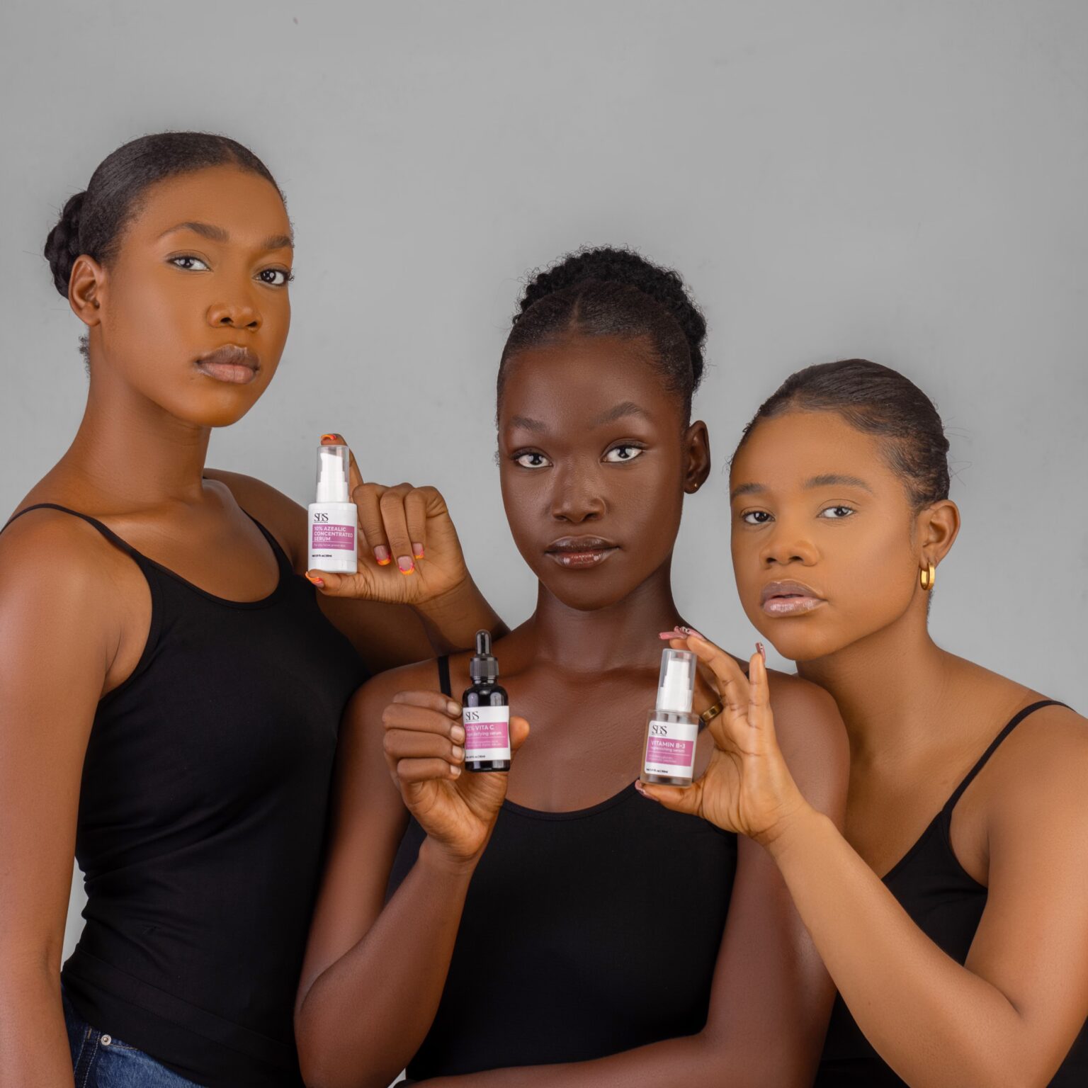 Three models holding SBS serums